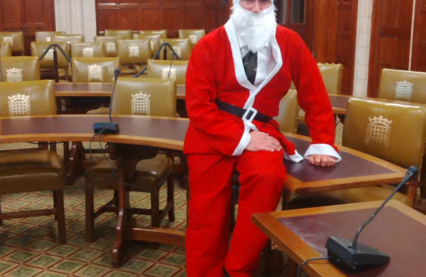 Henry Smith MP wears Santa Suit for Chestnut Tree House