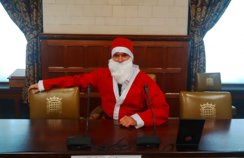 Henry Smith MP dons Santa Suit at work for Chestnut Tree House