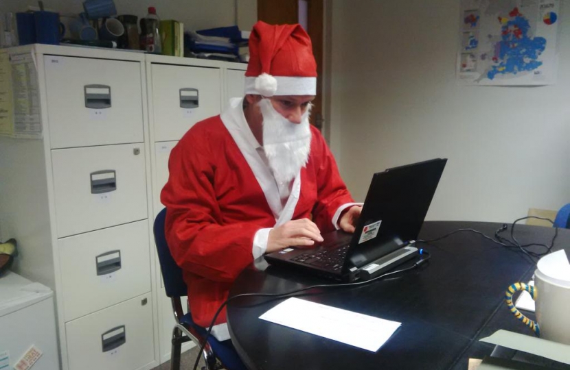 Henry Smith MP wears Santa Suit for Chestnut Tree House