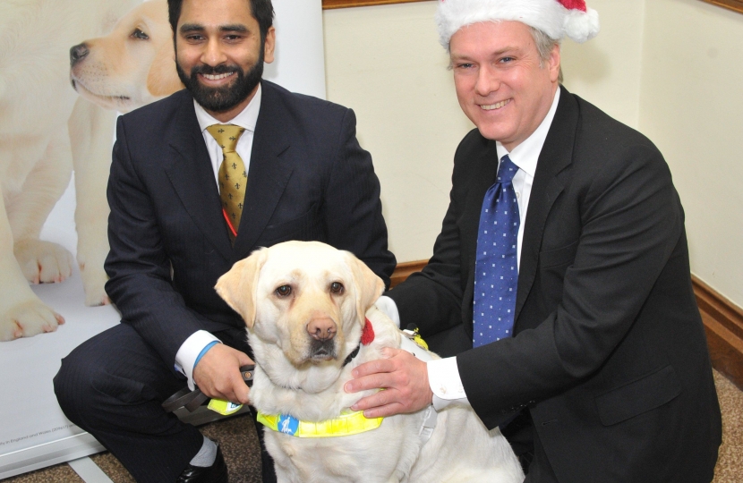 Henry Smith MP gets a visit from Guide Dogs' Santa Paws this Christmas