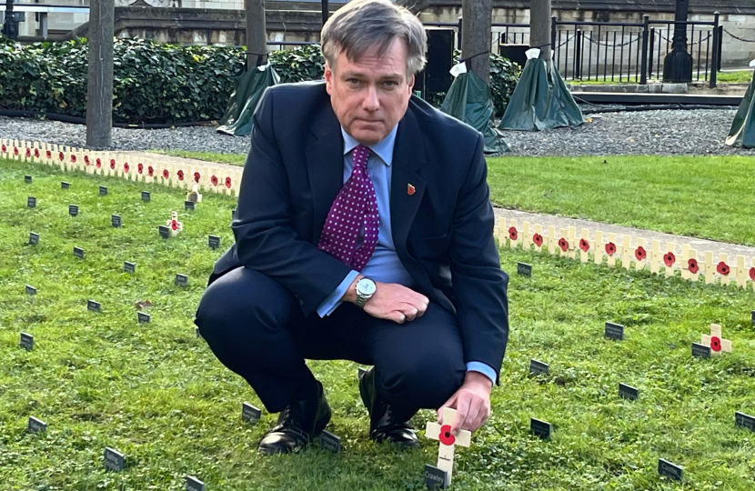 Henry Smith MP plants wooden cross in Constituency Garden of Remembrance in Parliament in honour of Crawley’s fallen