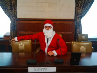 Henry Smith MP dons Santa Suit at work for Chestnut Tree House